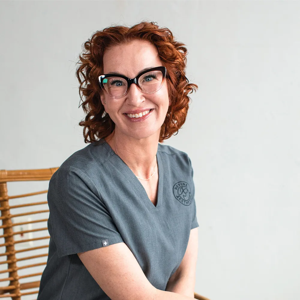Medical professional at Refine Aesthetics clinic in Colorado Springs, smiling warmly.
