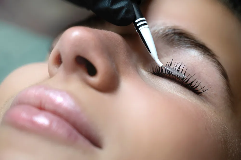 Eyelash treatment being applied at a Colorado Springs medical aesthetics clinic.